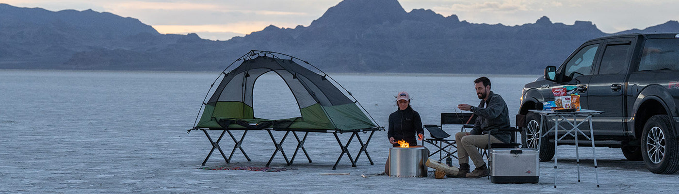 A couple camps on the Utah salt flats with their TETON Sports Vista Tent Bundle.